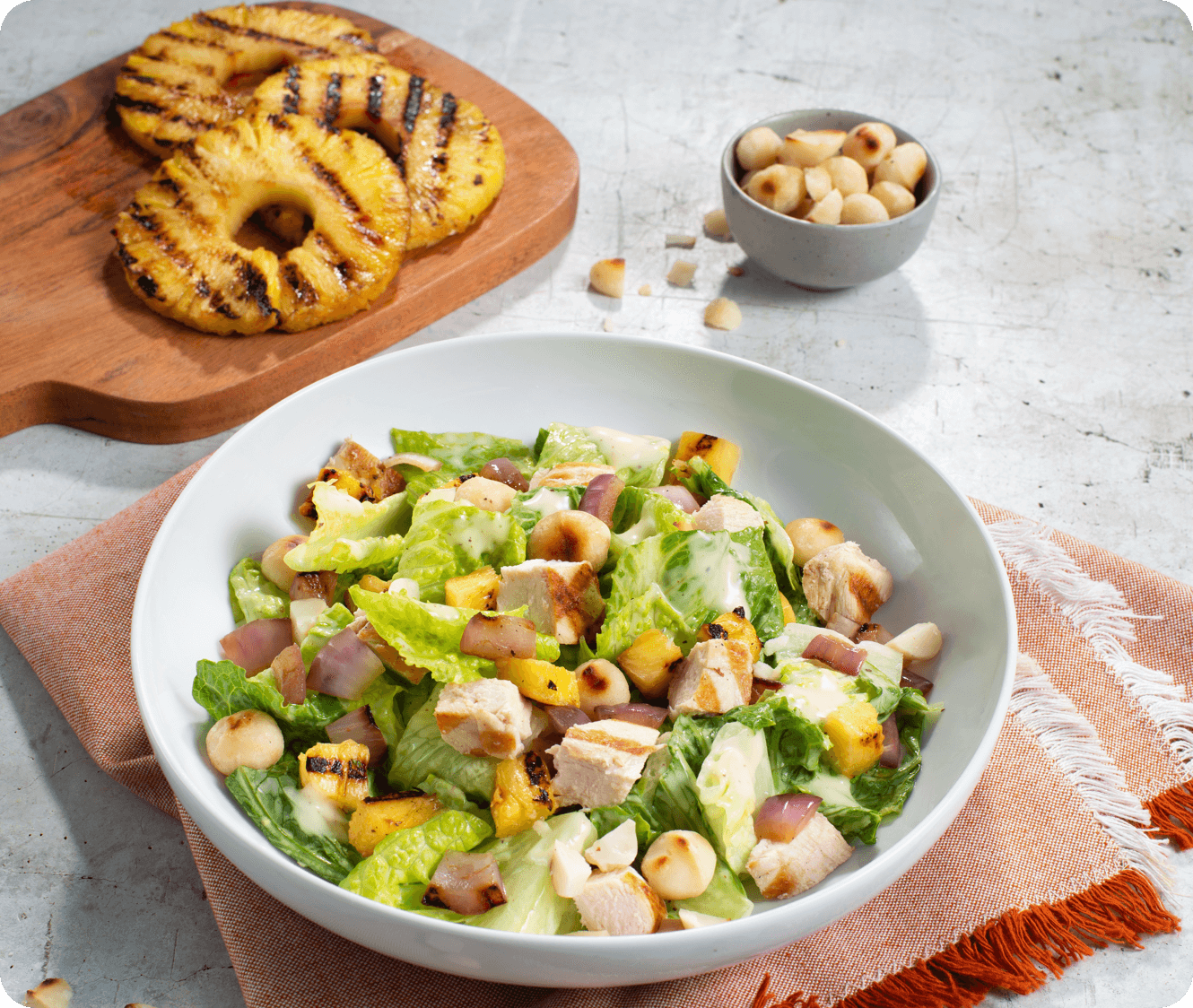 Hawaiian Chicken Caesar Salad with Macadamia Nuts